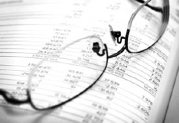 Glasses resting on an accounting book.