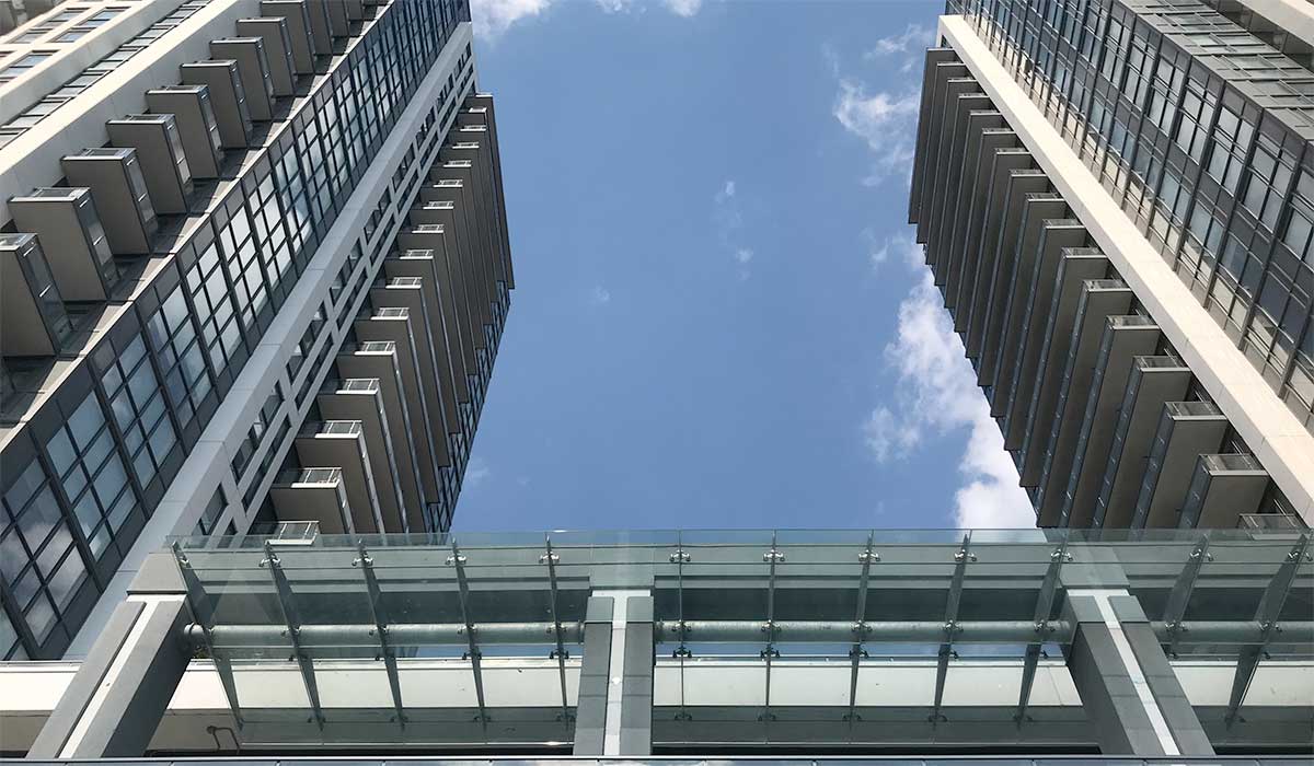 Exterior bottom-up image of IQ Condos Toronto.