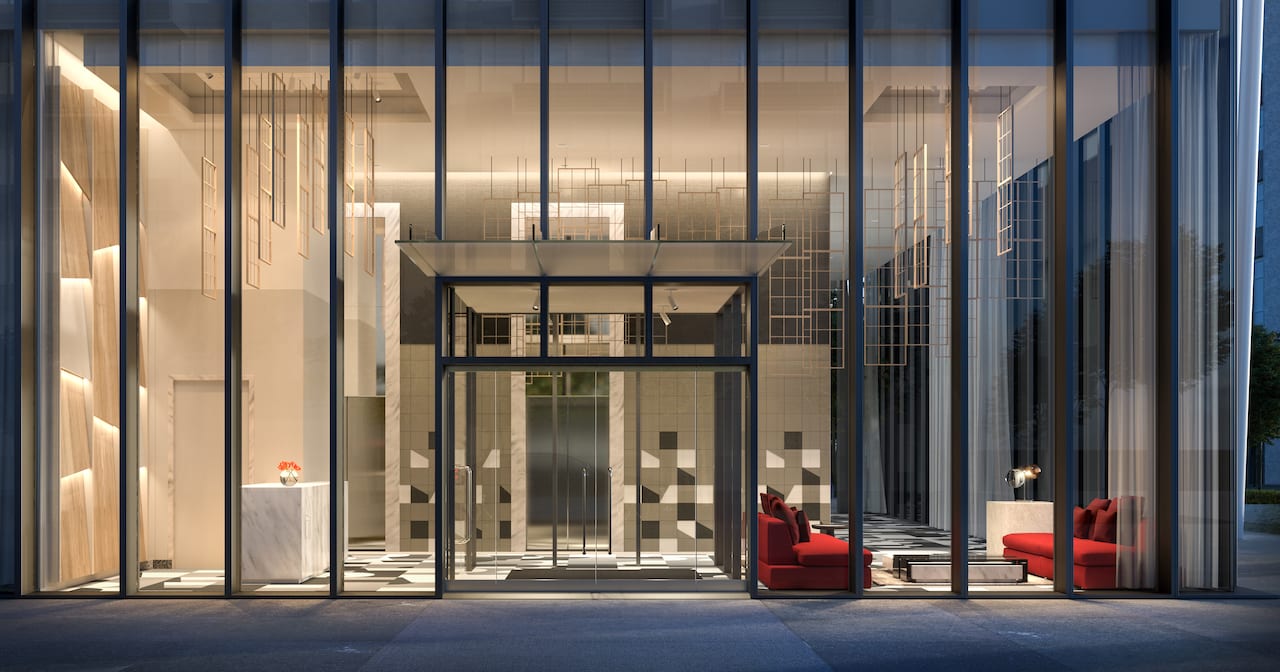 Rendering of Television City Condos exterior of lobby looking through windows at night