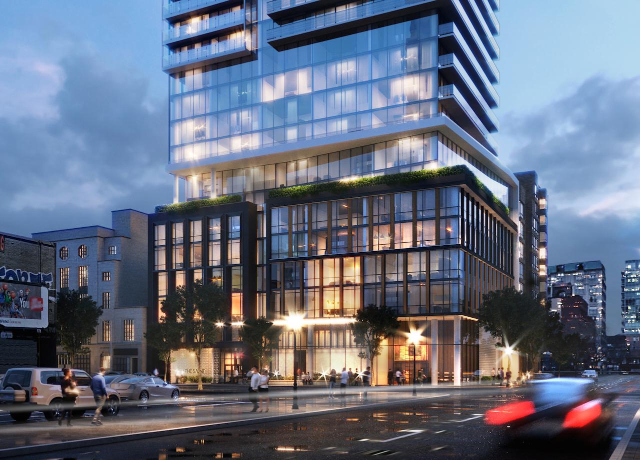 The Saint Condos exterior podium at night