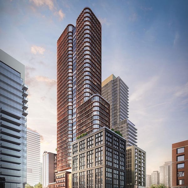 Four Eleven King Condos exterior with surrounding cityscape.
