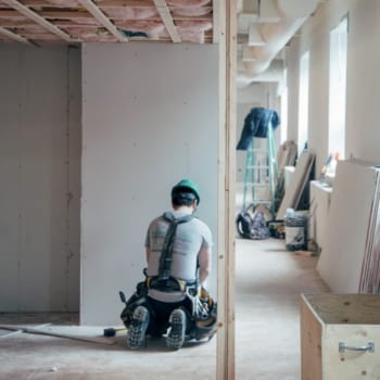 A person renovating a condominium unit.