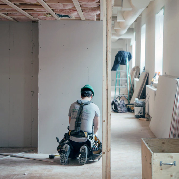 A person renovating a condominium unit.