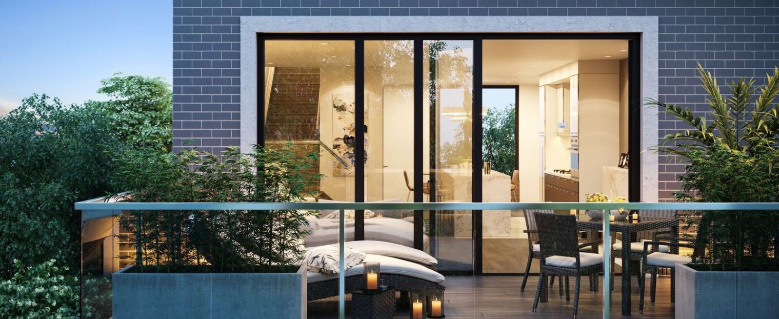 Rendering of the Wycliffe Promenade Towns exterior balcony at night.