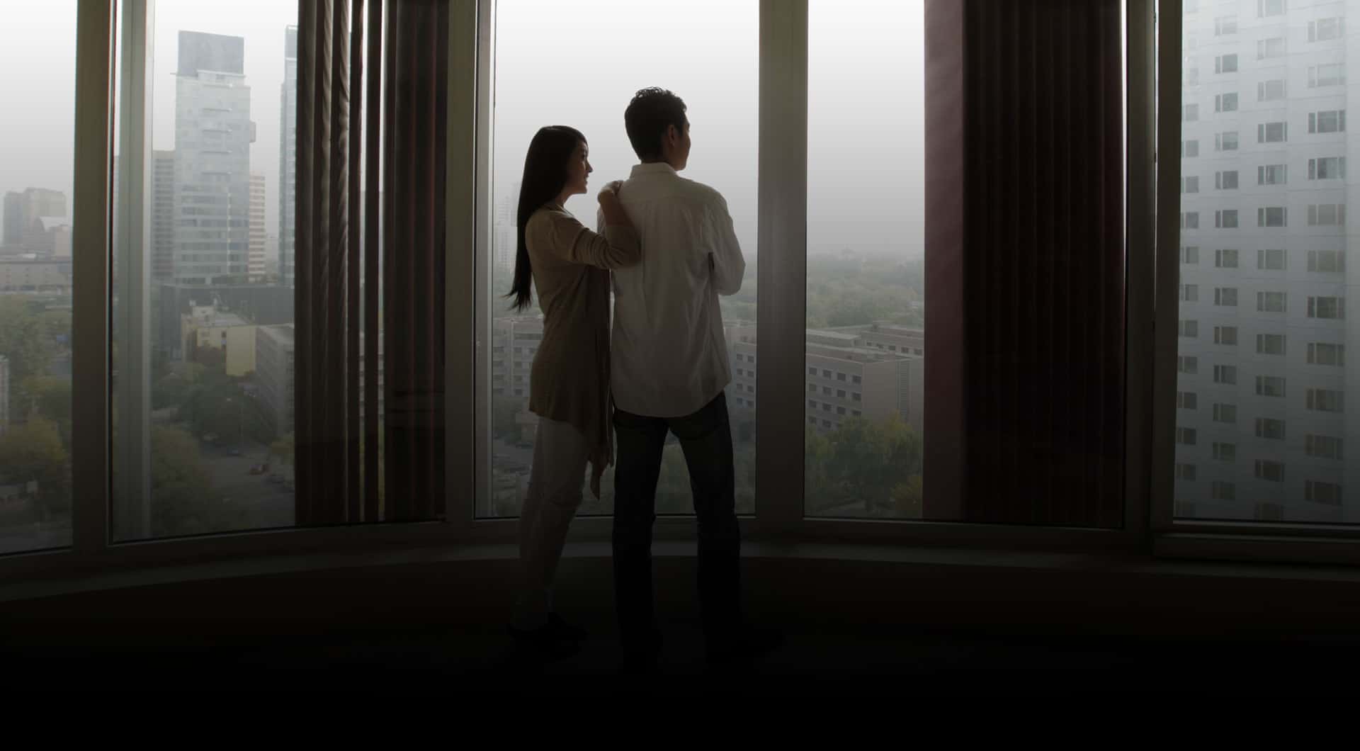 Rendering of The Howard High Park interior window with a couple looking at the view.