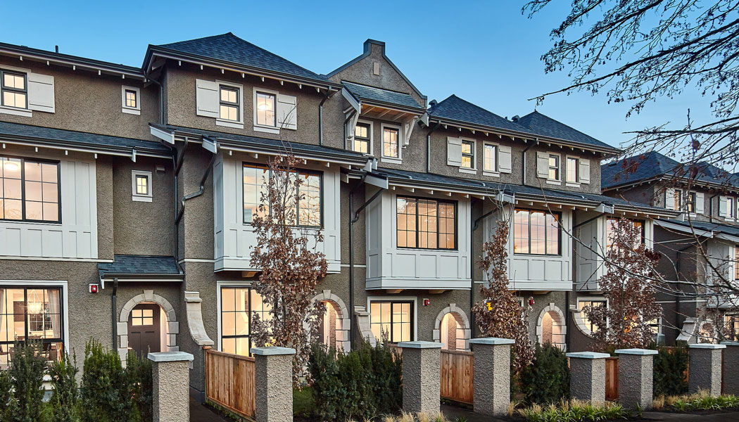 Modern townhome exterior in the evening.