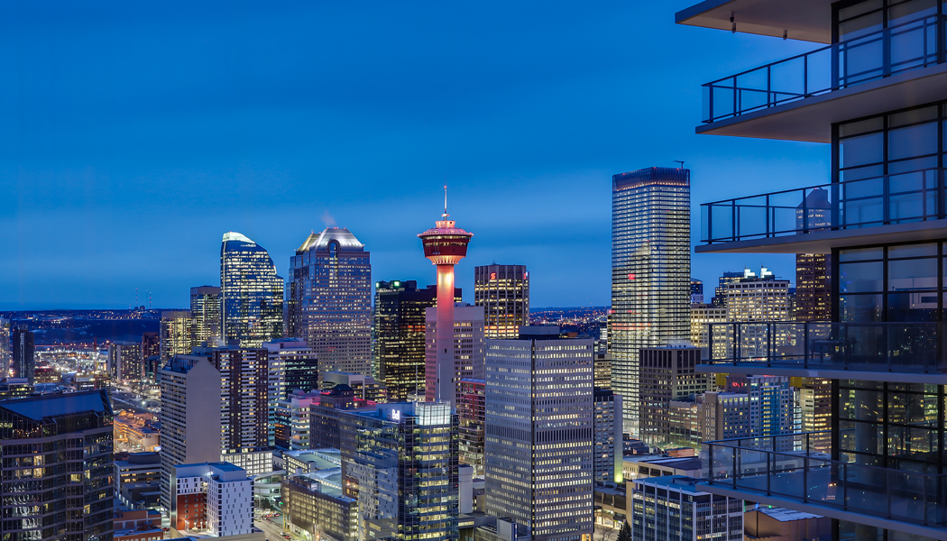 Views of the Toronto skyline at night.