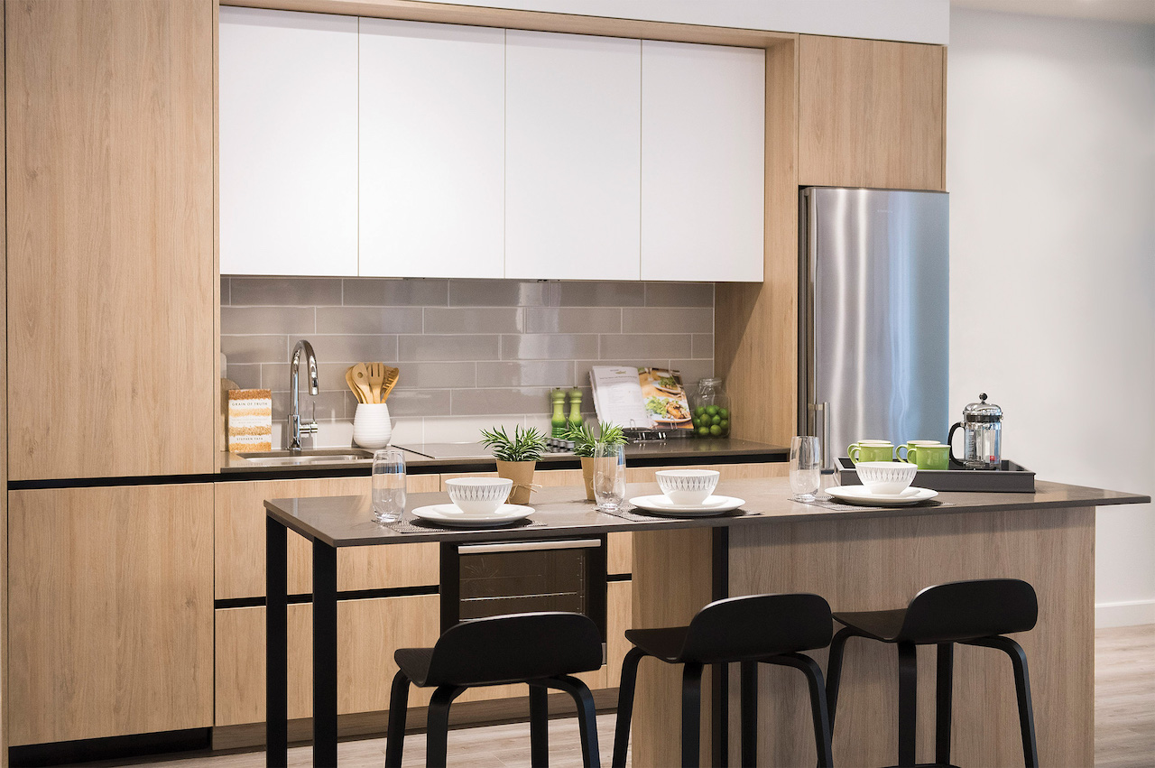 Rendering of Artsy Condos suite interior kitchen with island seating.