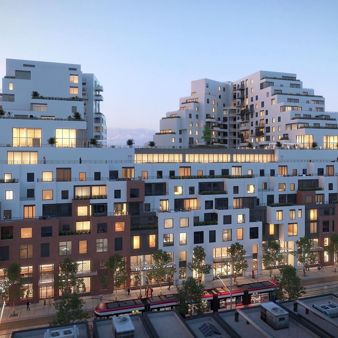 Exterior rendering of Queen & Ashbridge Condos building side at night.