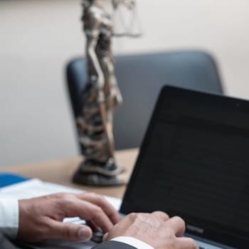Lawyer working on a laptop.