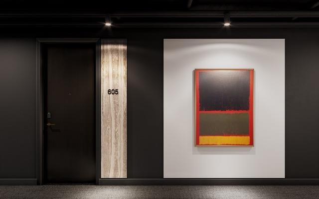 Rendering of The Carvalo on College Condos unit corridor with dark architectural features.