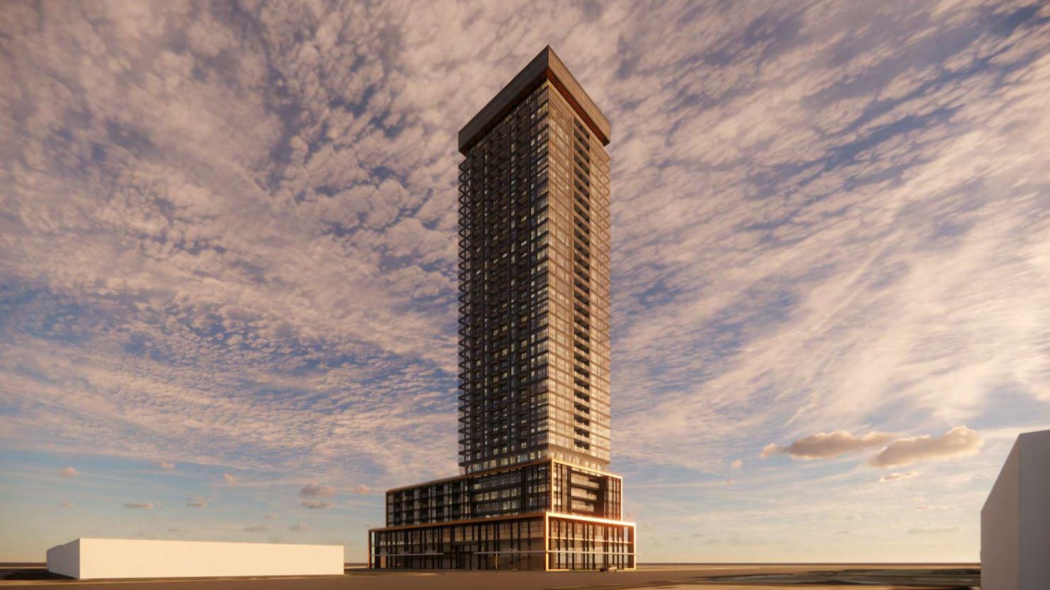 Rendering of 1910 Eglinton East Condos exterior at dusk.