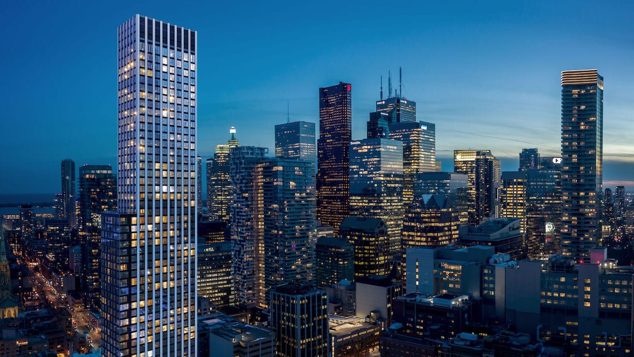 Exterior rendering of Queen Church Condos at night with skyline view
