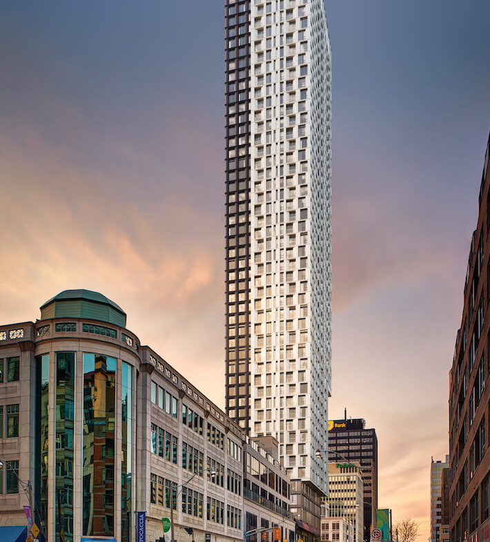 Rendering of The Hill Condos exterior side view at dusk