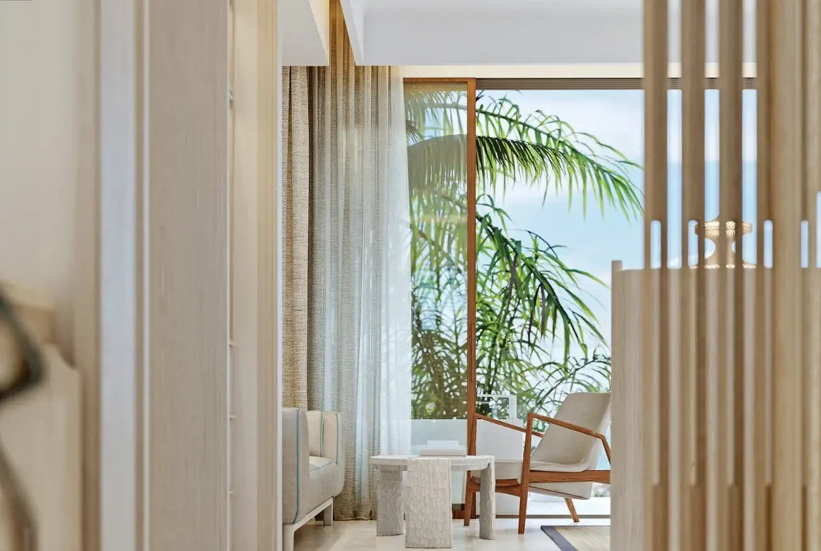 Cozy seating corner with a serene ocean view from a luxury room in Vie L'Ven, St. Maarten.