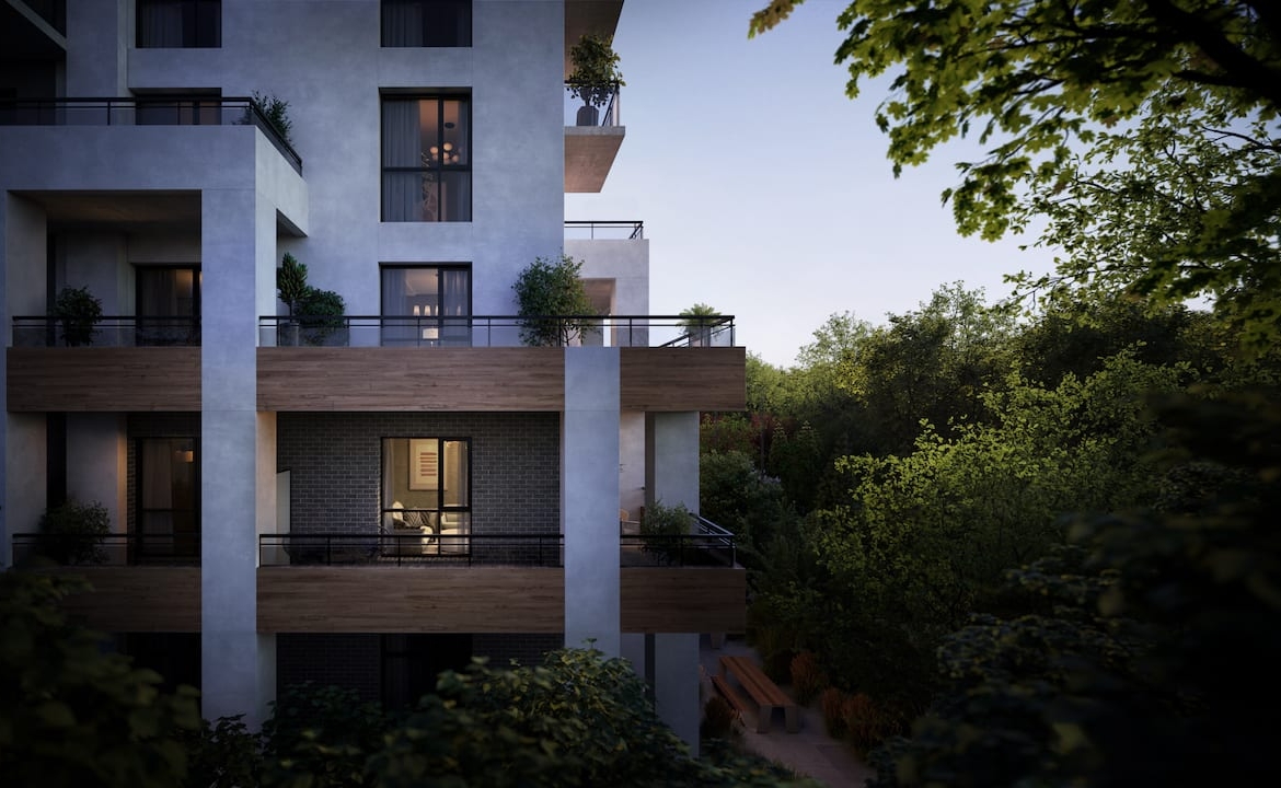 Mile and Creek Phase 3 Condos exterior at dusk surrounded by greenery
